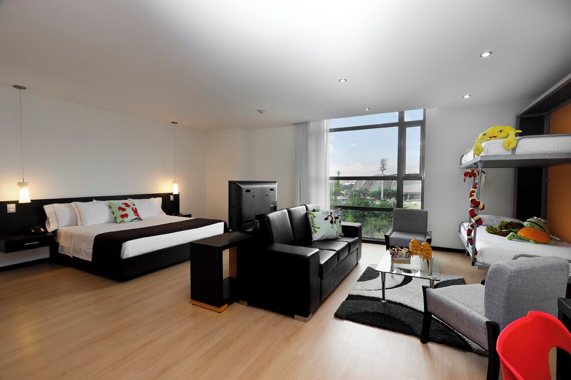 Family Room, Multiple Beds | Down comforters, minibar, in-room safe, desk