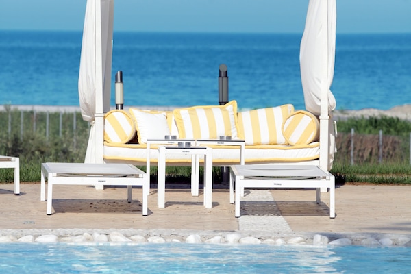 Outdoor pool, open 11:00 AM to 7:00 PM, pool umbrellas, pool loungers