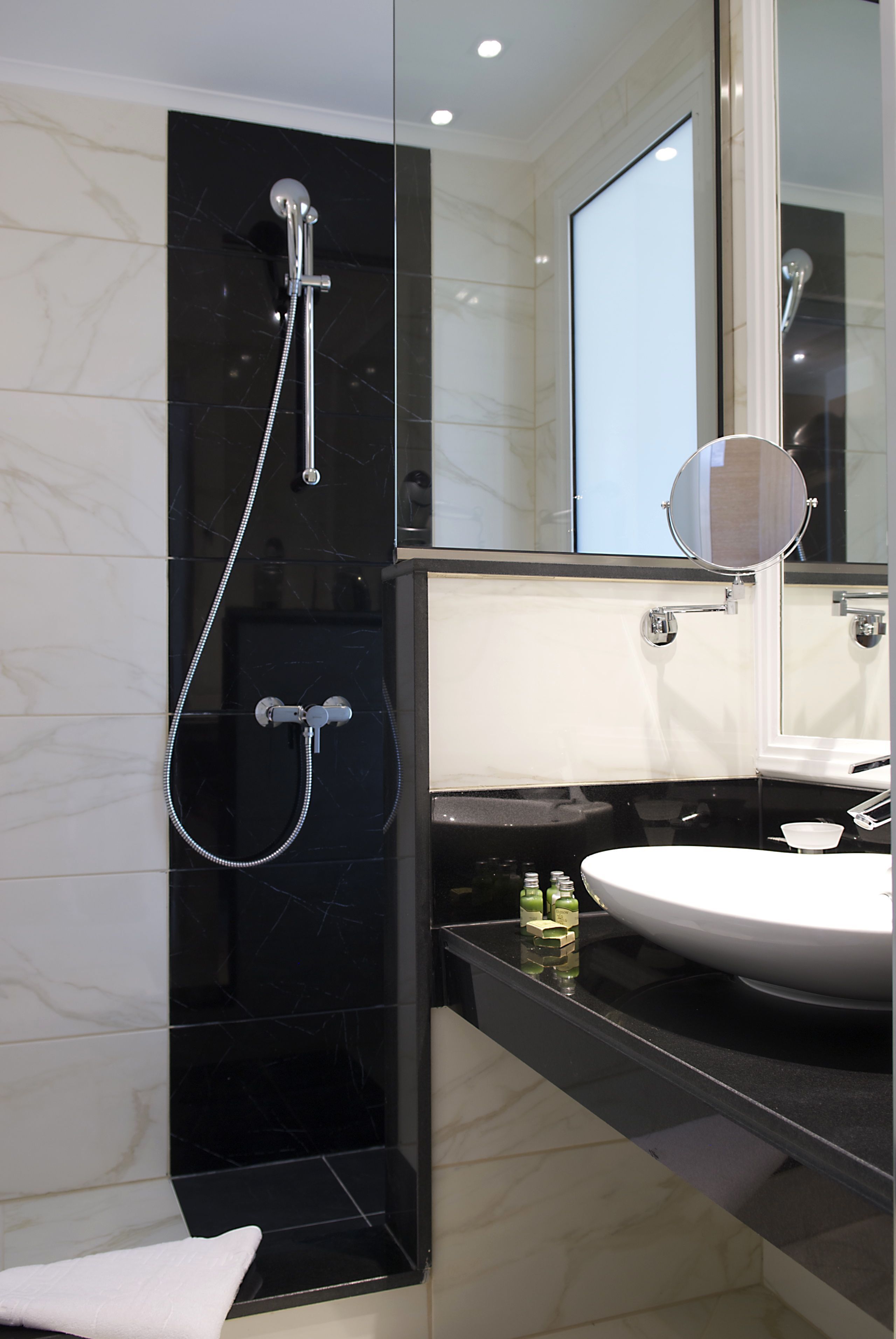 rainfall showerhead, designer toiletries, hair dryer, slippers