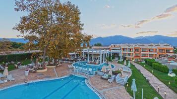 Outdoor pool, open 11:00 AM to 7:00 PM, pool umbrellas, pool loungers