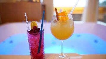 Two drinks on a table with a blurred background.