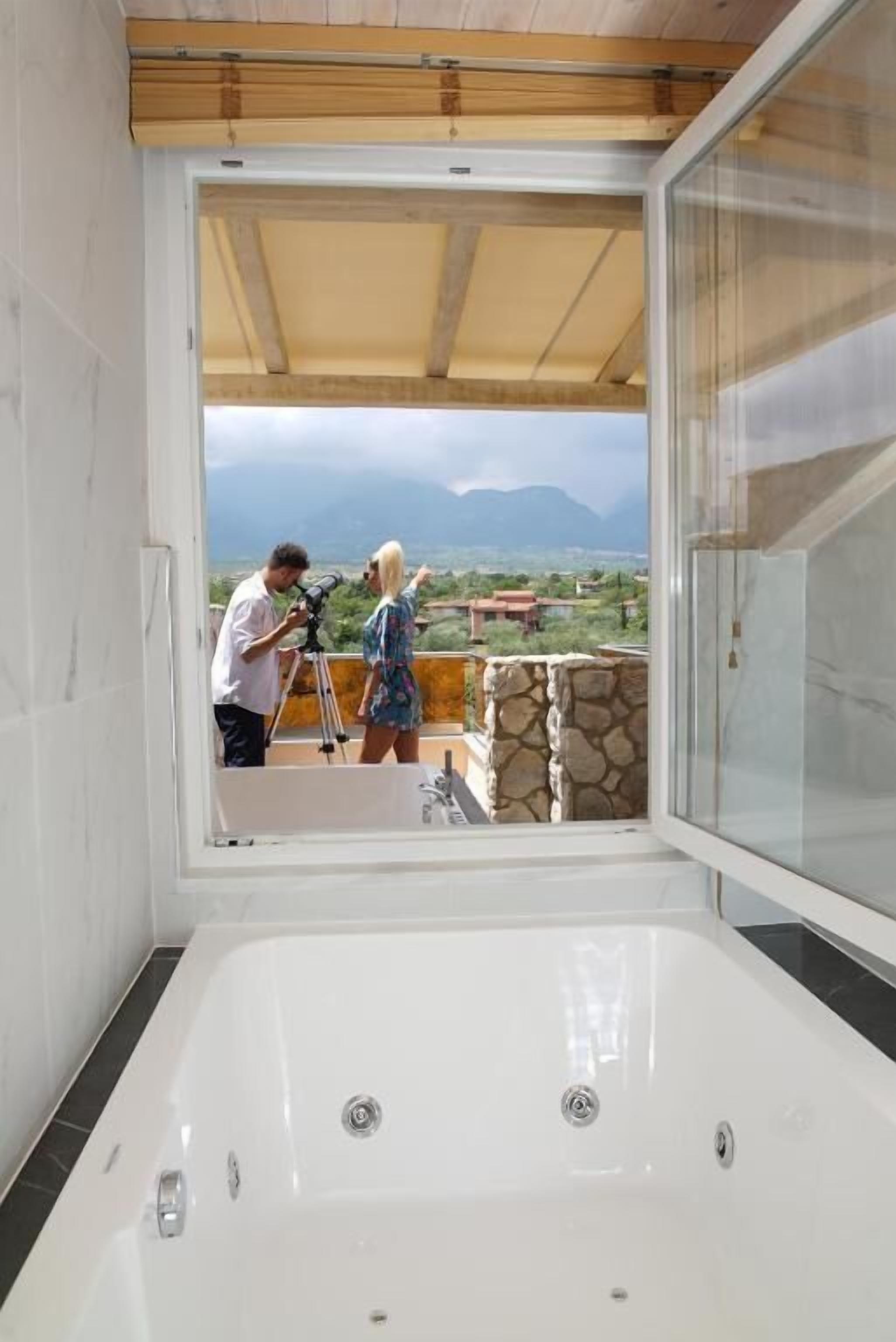 executive suite, jetted tub (olympus) | bathroom | rainfall showerhead, designer toiletries, hair dryer, slippers