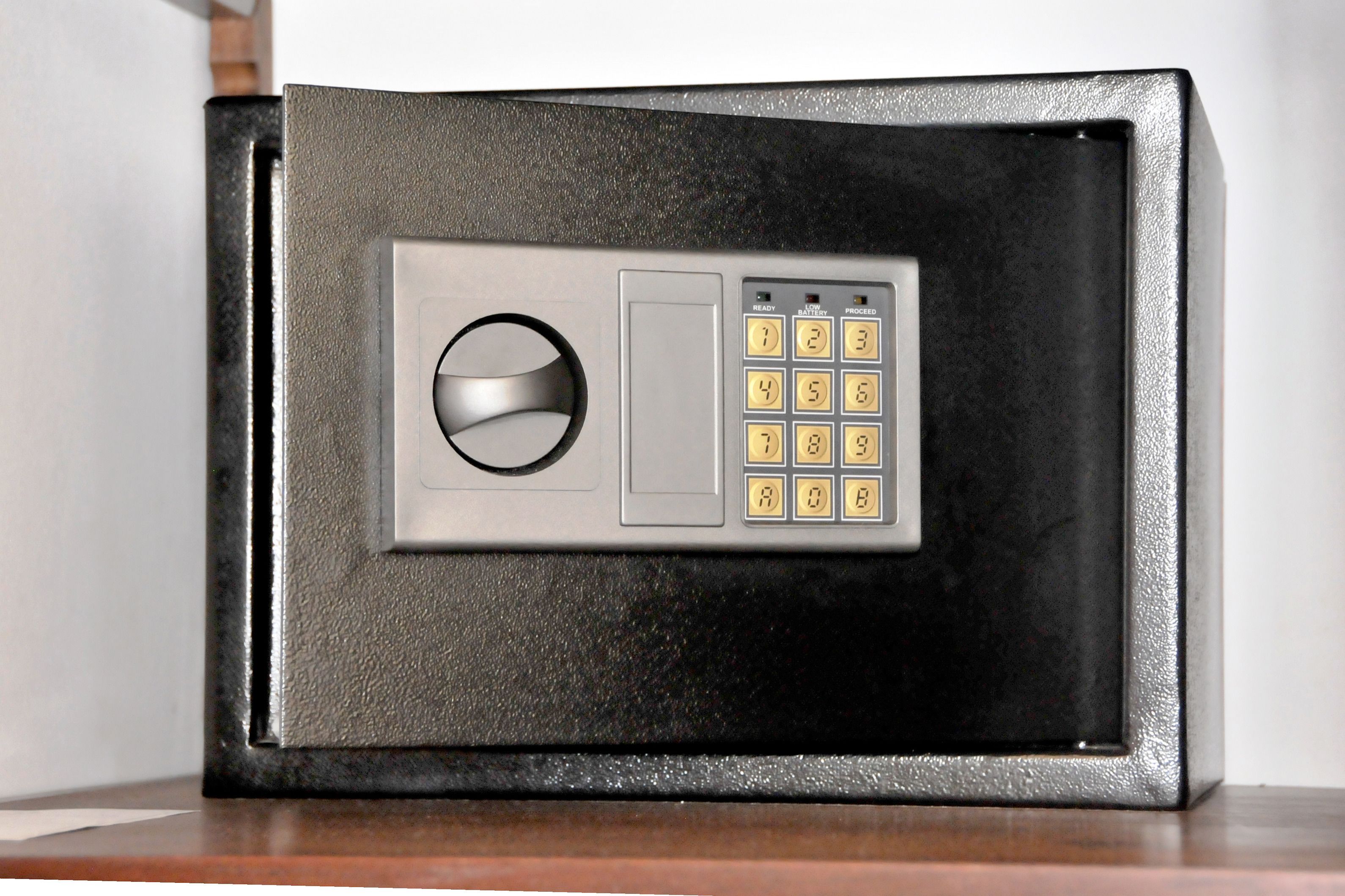 A safe with a keypad and a circular lock mechanism.