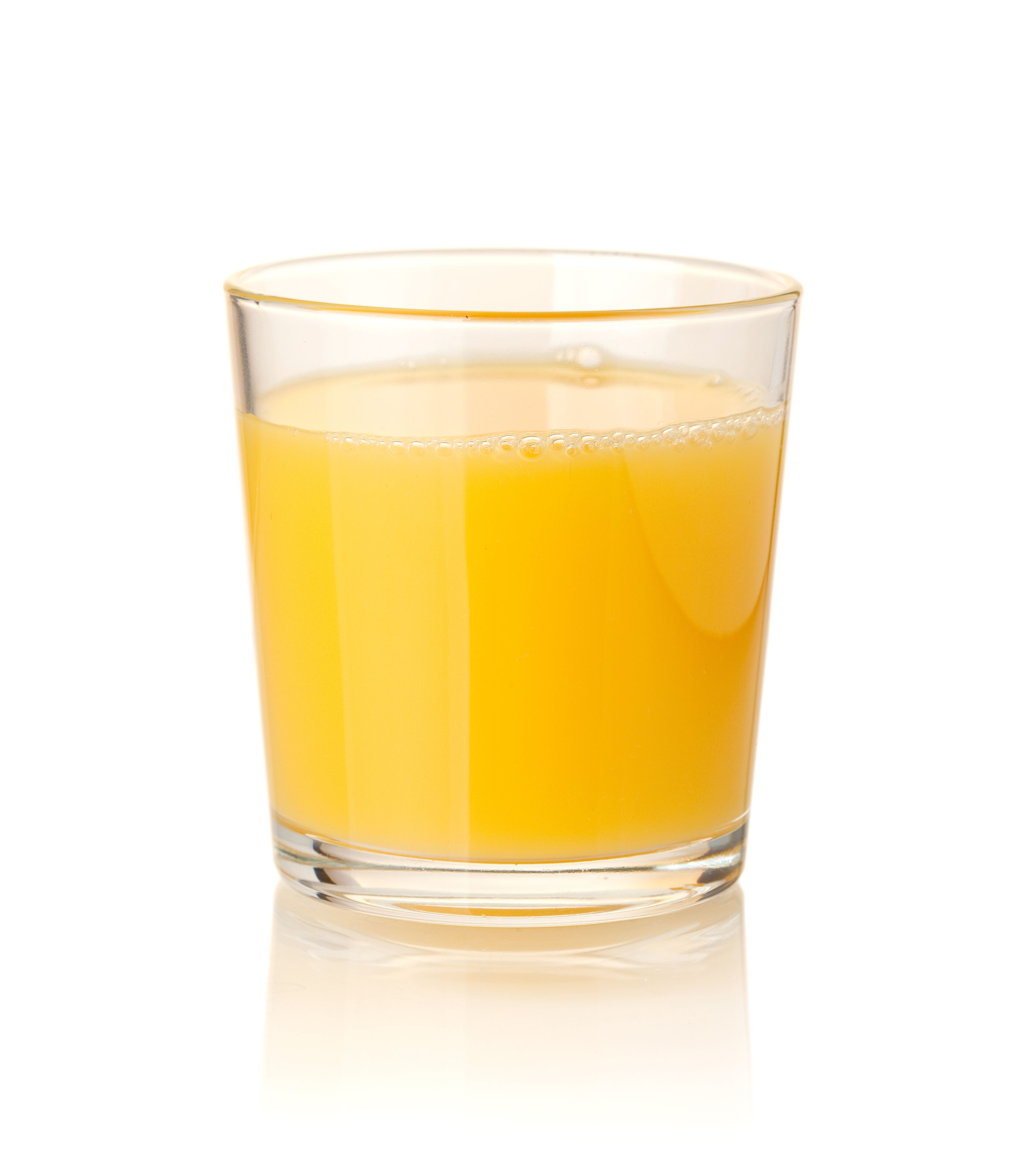 A clear glass of orange juice.