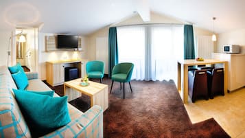 Standard Suite | Living area | Flat-screen TV