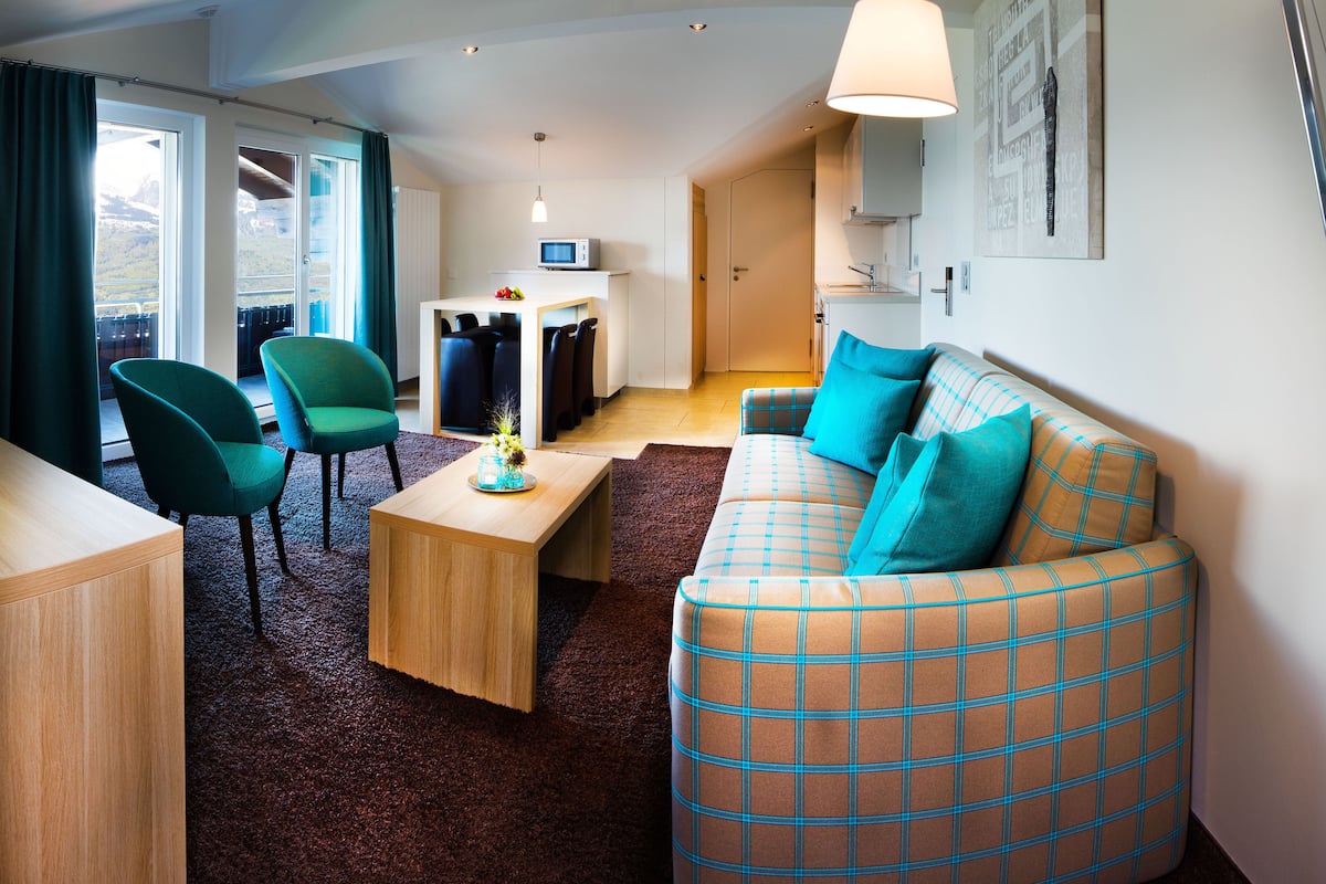 Standard Suite | Living area | Flat-screen TV