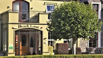 A building with a sign reading "Brook Lane."