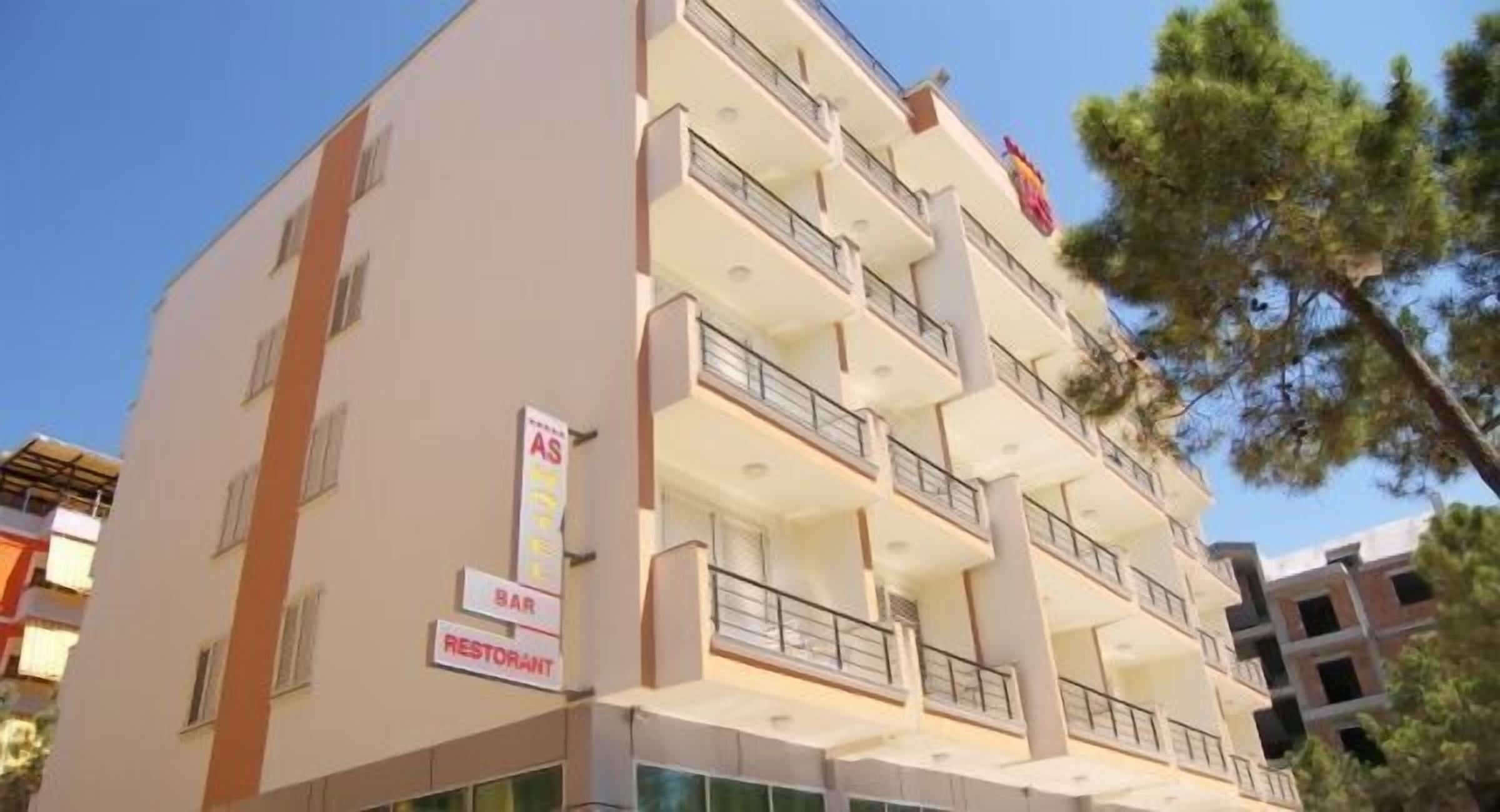 A multi-story hotel with balconies, a bar, and a restaurant.