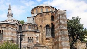 A historic building with multiple domes and a minaret, likely a mosque or cathedral. - Ancient Town Hotel (Istanbul)