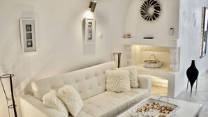 Executive Suite, Jetted Tub, Sea View (Cave Ikaros) | Living area | 24-inch flat-screen TV with satellite channels, TV - Aeolos Art and Eco Suites - Adults Only (Santorini)