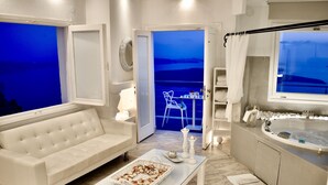 Honeymoon Suite, Jetted Tub, Sea View (Aegeo) | Living area | 24-inch flat-screen TV with satellite channels, TV - Aeolos Art and Eco Suites - Adults Only (Santorini)