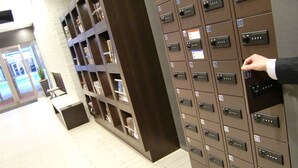 A row of numbered lockers in a hallway. - Hotel Vista Sapporo Odori (Sapporo)