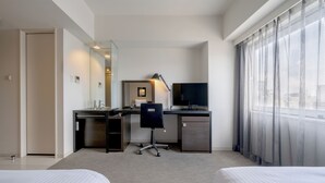 A hotel room with a bed, a desk with a chair, a television, and a large window with sheer curtains. - Hotel Vista Sapporo Odori (Sapporo)