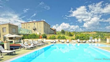 Indoor pool, seasonal outdoor pool, pool umbrellas, sun loungers