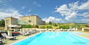 Indoor pool, seasonal outdoor pool, pool umbrellas, pool loungers