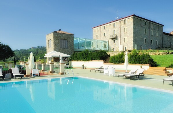 Indoor pool, seasonal outdoor pool, pool umbrellas, pool loungers