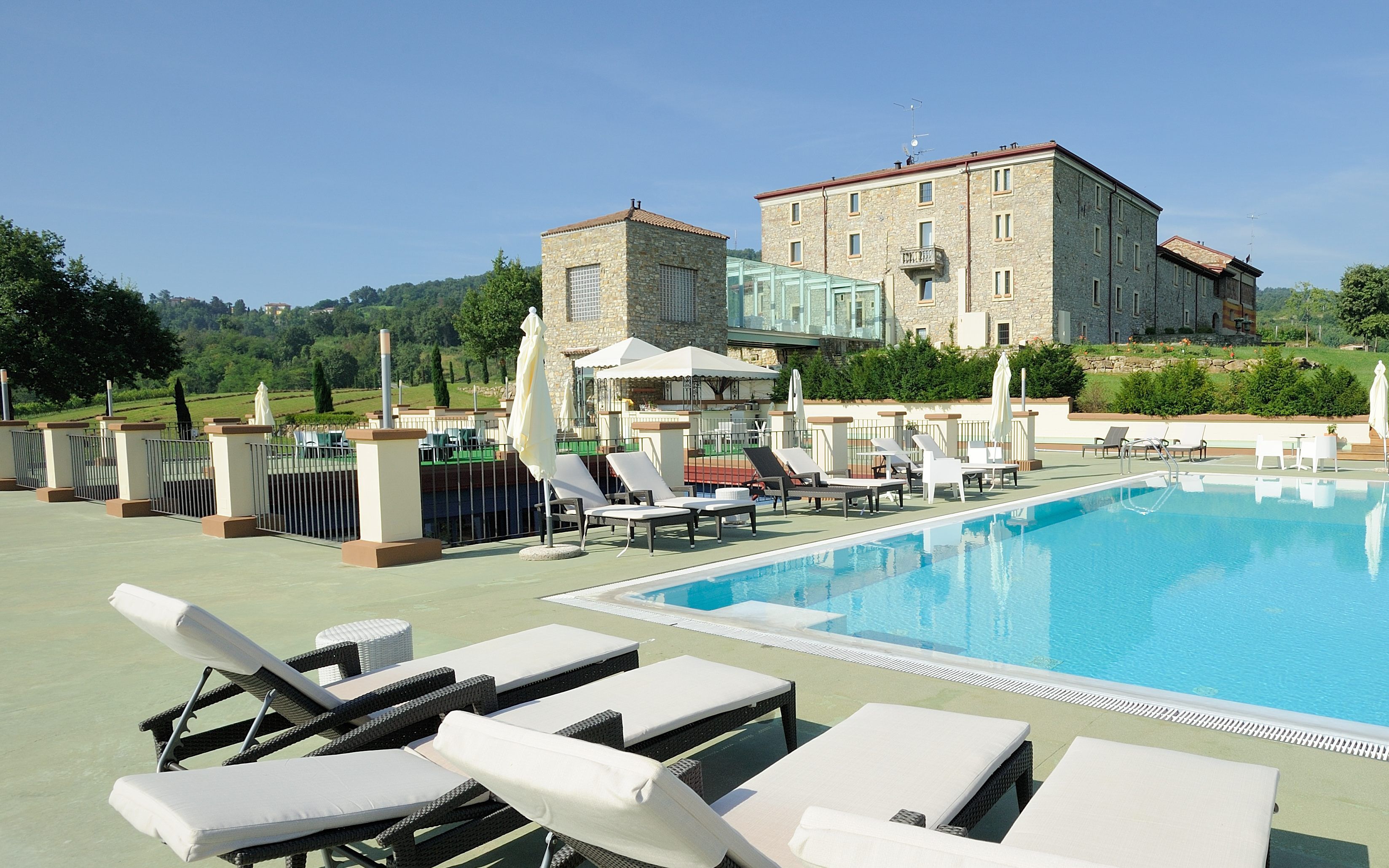 Indoor pool, seasonal outdoor pool, pool umbrellas, pool loungers