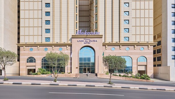 A large, modern building with a prominent arched entrance and the name 'Makarem' displayed above.