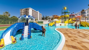 A water park with slides and play structures, a pool, and a building in the background. - Globales Playa Estepona (Estepona)