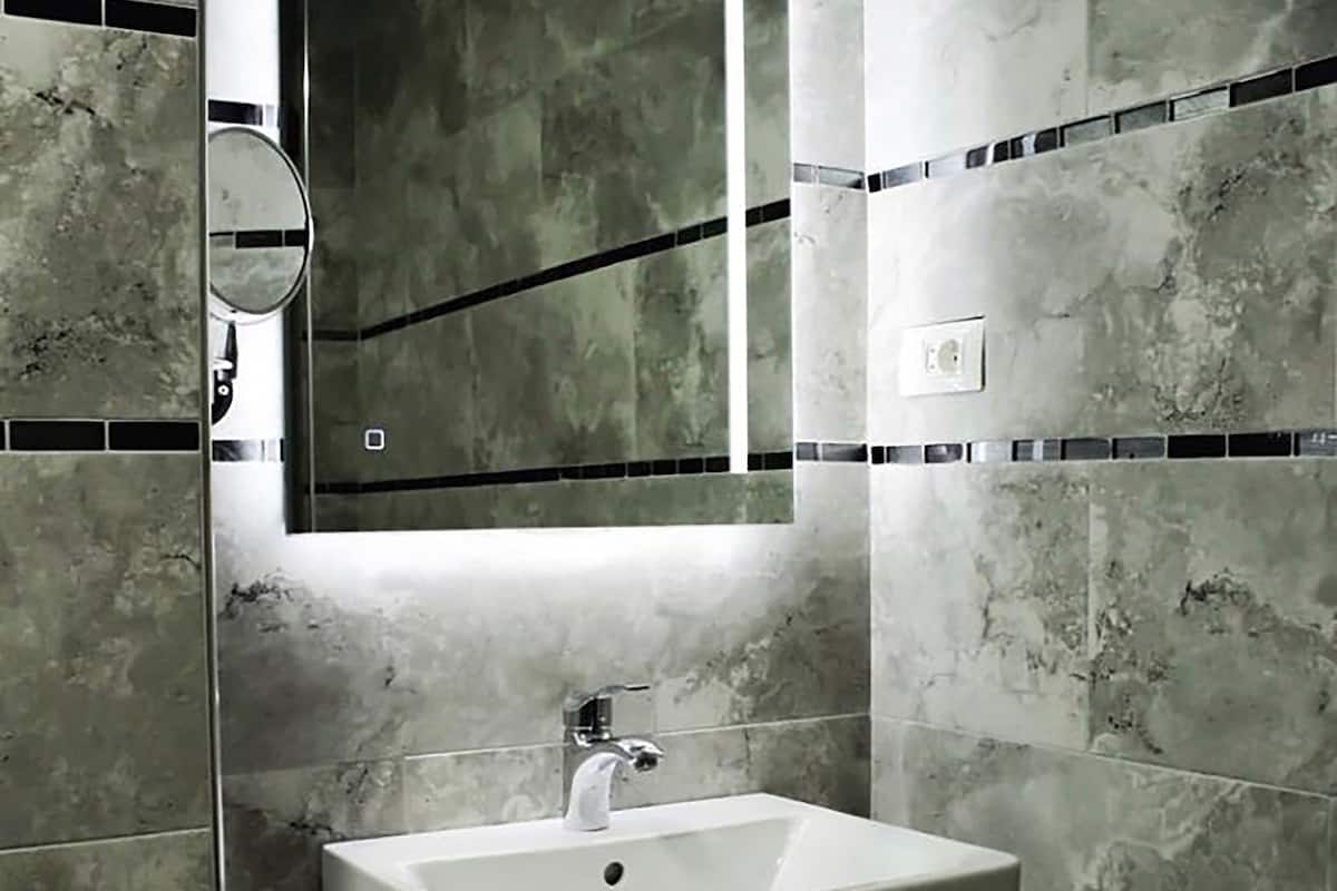 shower, hair dryer, bathrobes, slippers