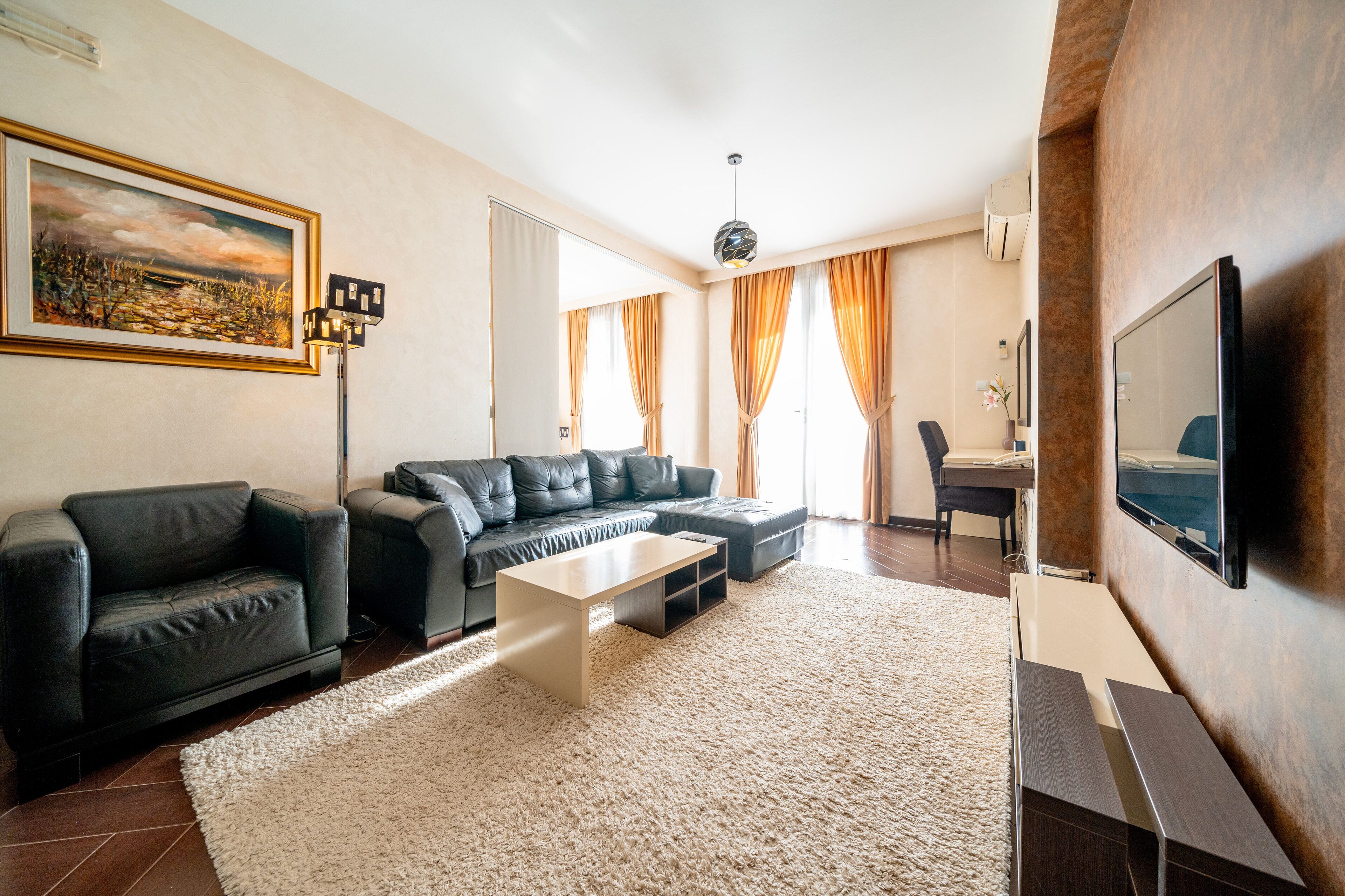 junior apartment | living area | 60-inch tv with cable channels