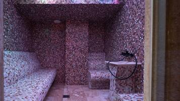 A tiled room with a bench, a small table, and a shower area.
