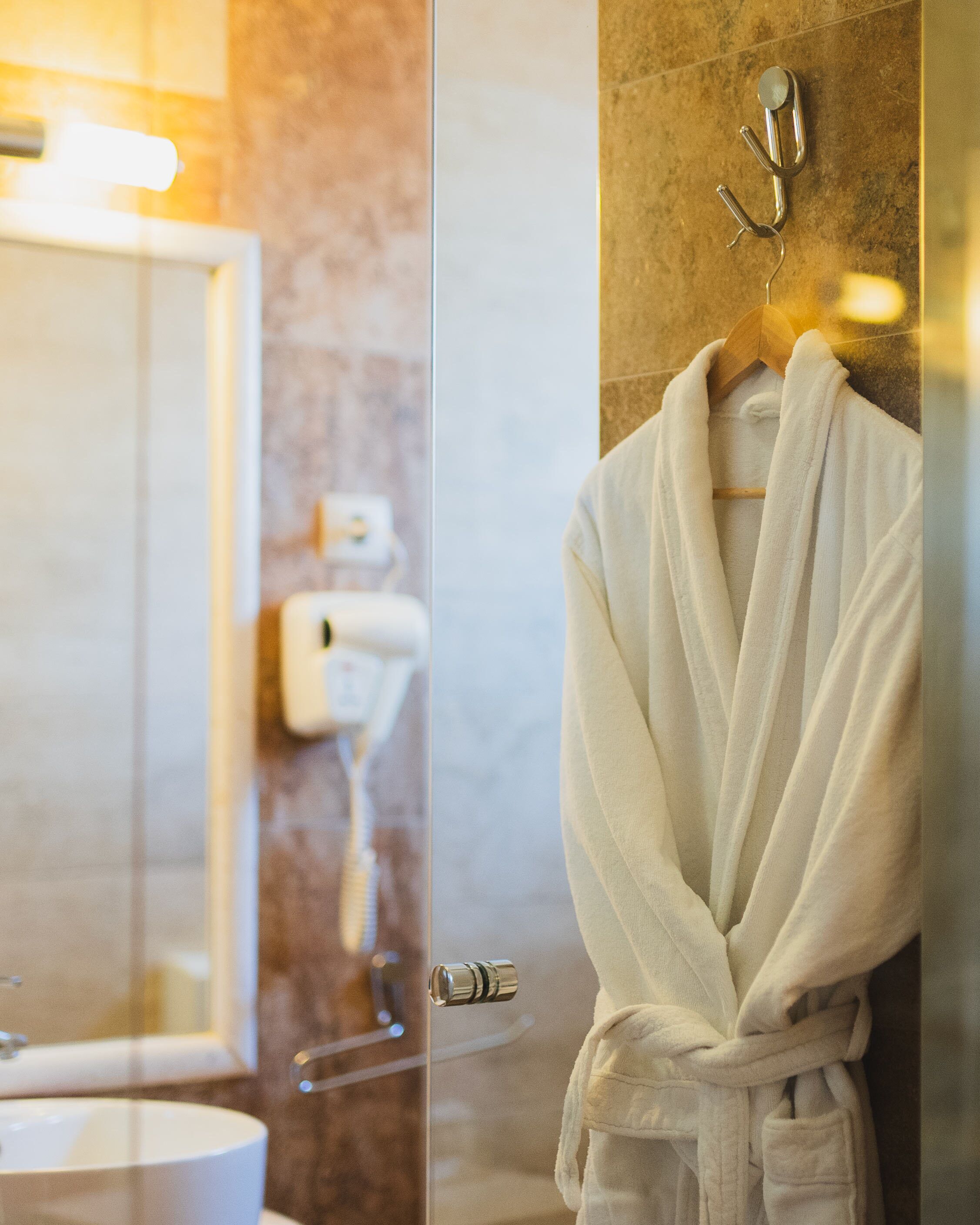 standard double or twin room | bathroom | shower, hair dryer, bathrobes, slippers