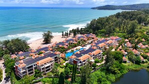 A resort with multiple buildings, a swimming pool, and a beach. - Mövenpick Phuket Bangtao (Choeng Thale)