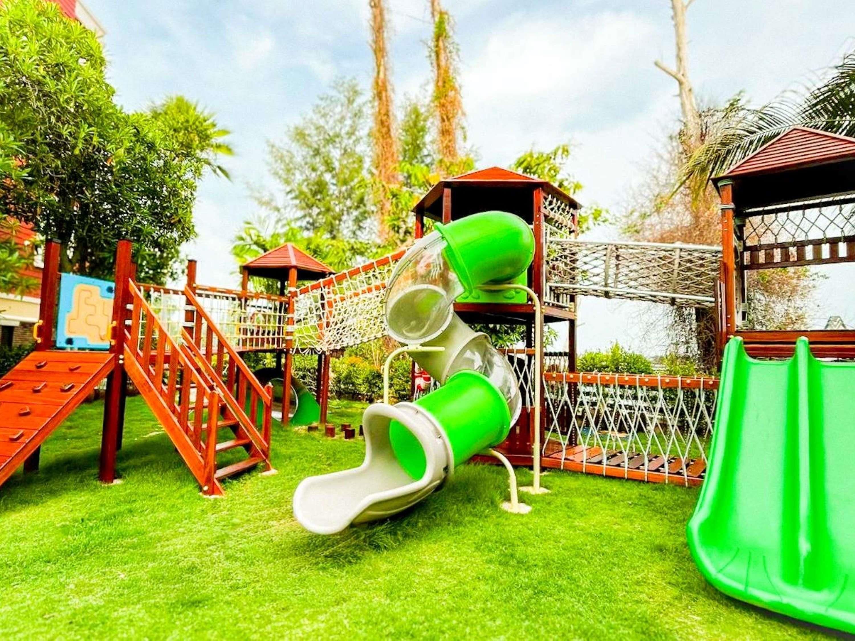 A playground with slides and climbing structures.