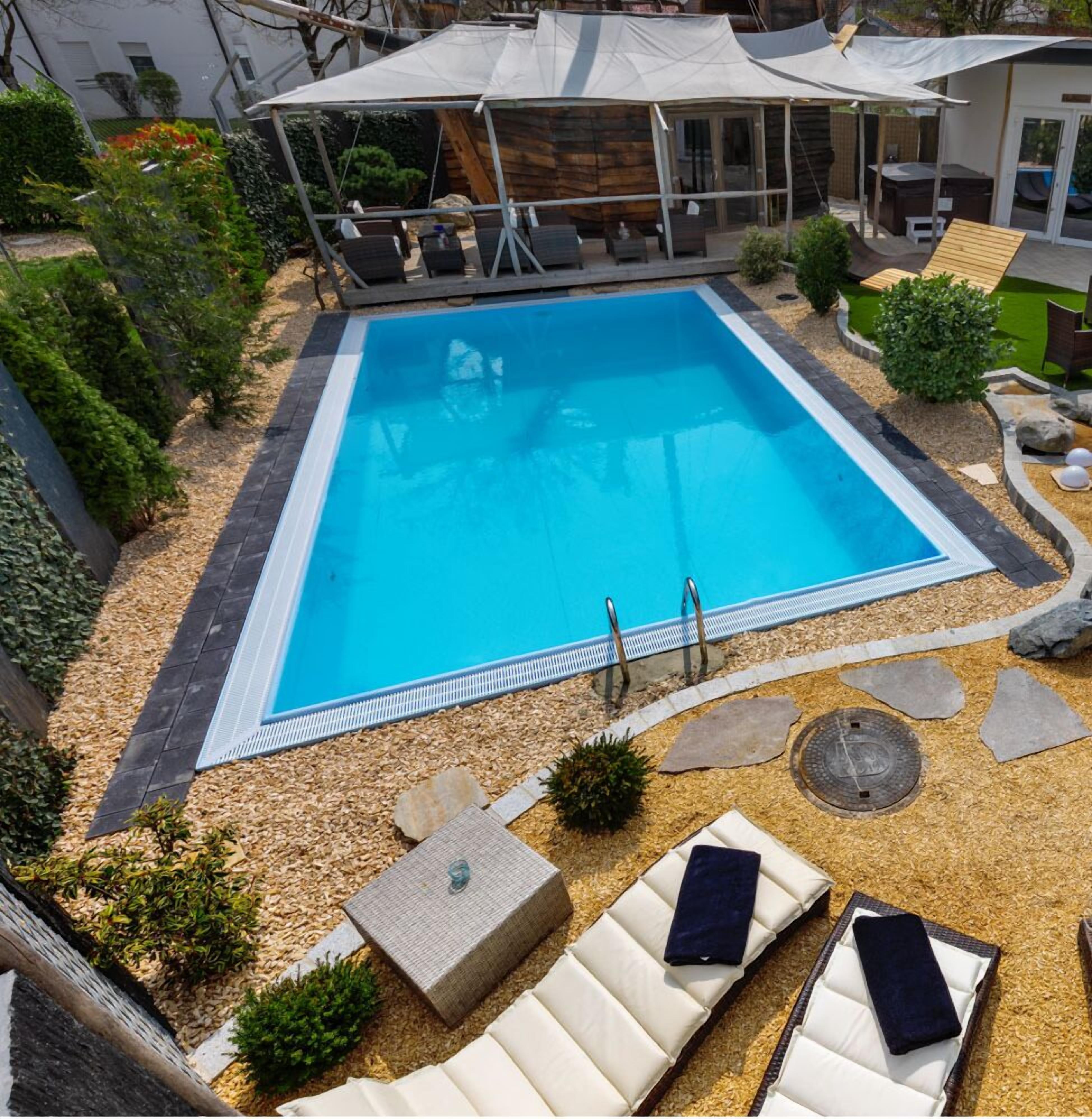 outdoor pool, pool umbrellas, pool loungers