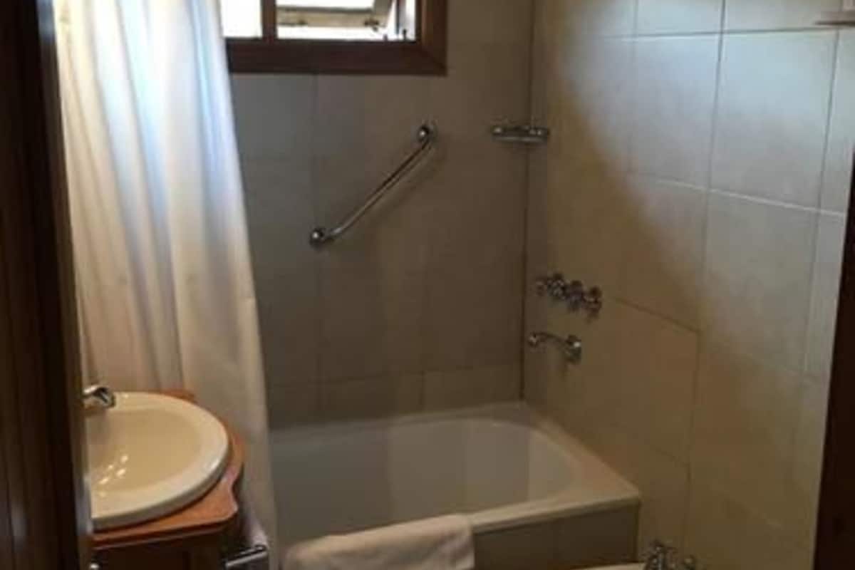 family suite | bathroom | combined shower/bathtub, hair dryer, towels