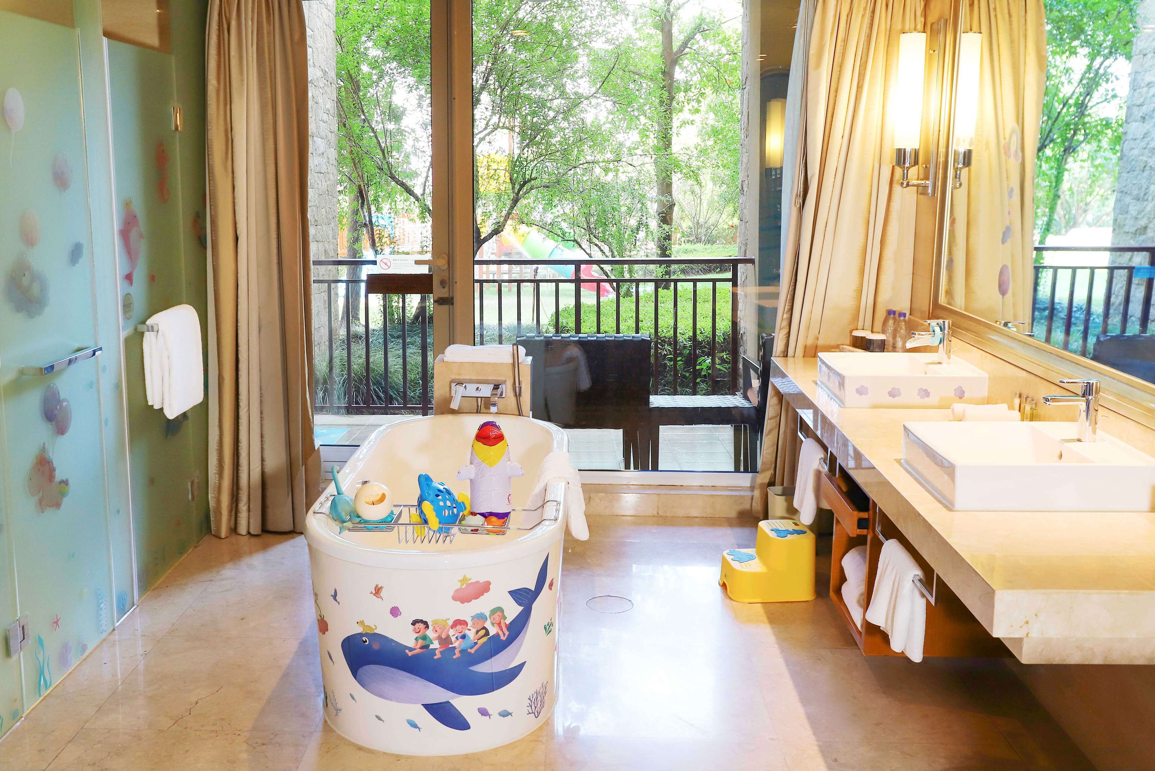 family room, 1 king bed | bathroom | separate bathtub and shower, rainfall showerhead, designer toiletries