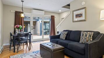 Suite, 2 Bedrooms (stairs required) | Living area | Flat-screen TV