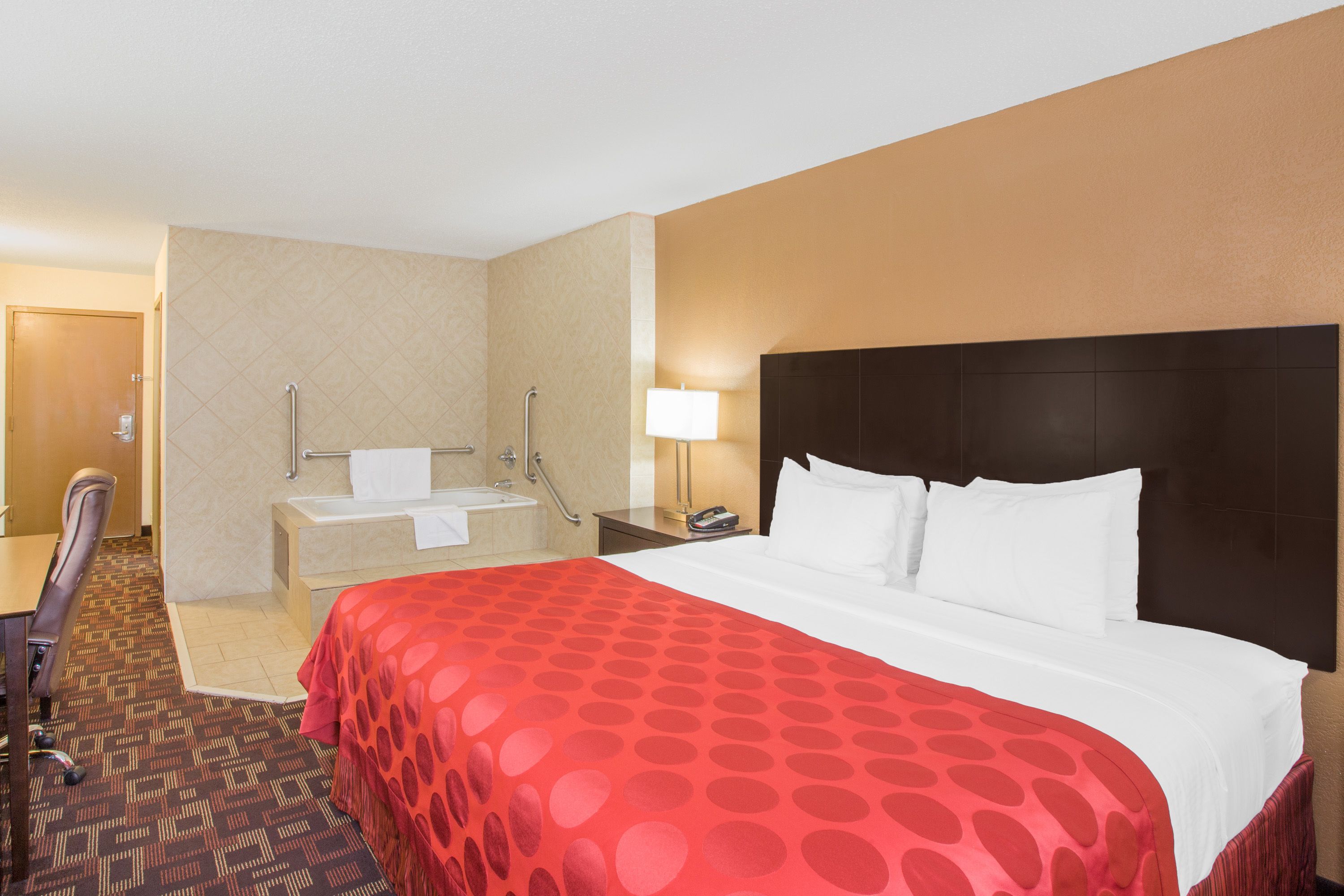 deluxe room, 1 king bed, non smoking | pillow-top beds, in-room safe, desk, iron/ironing board