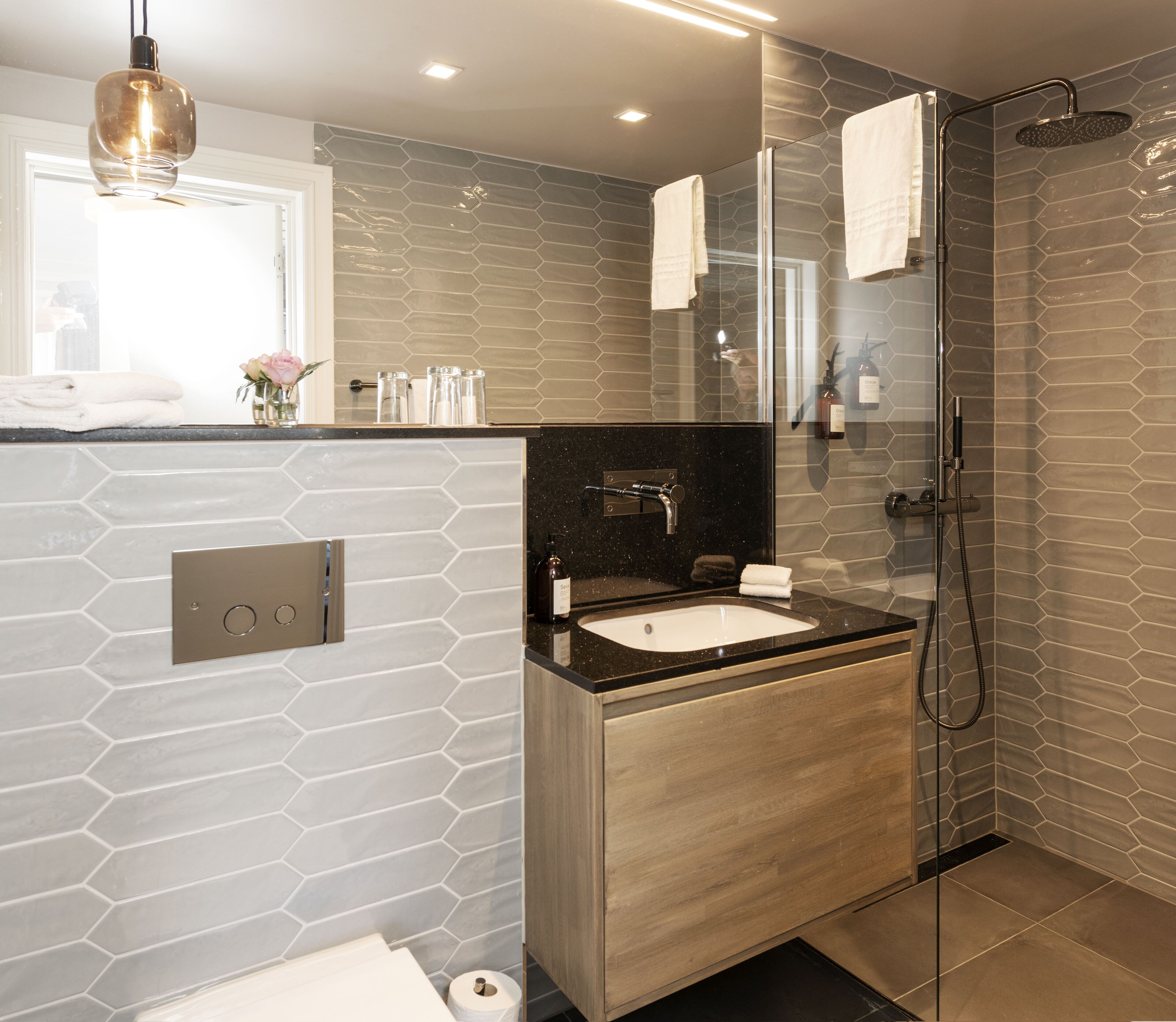 shower, rainfall showerhead, designer toiletries, towels