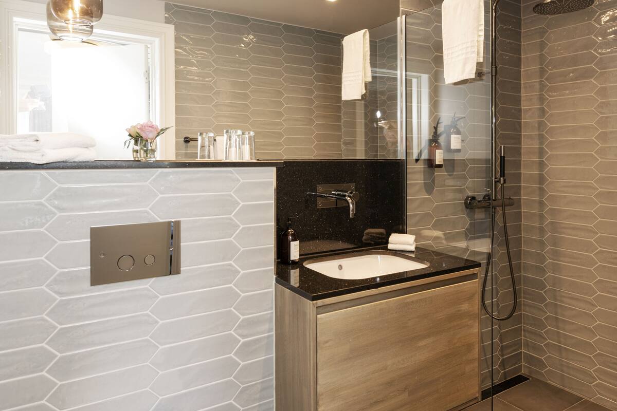 shower, rainfall showerhead, designer toiletries, towels