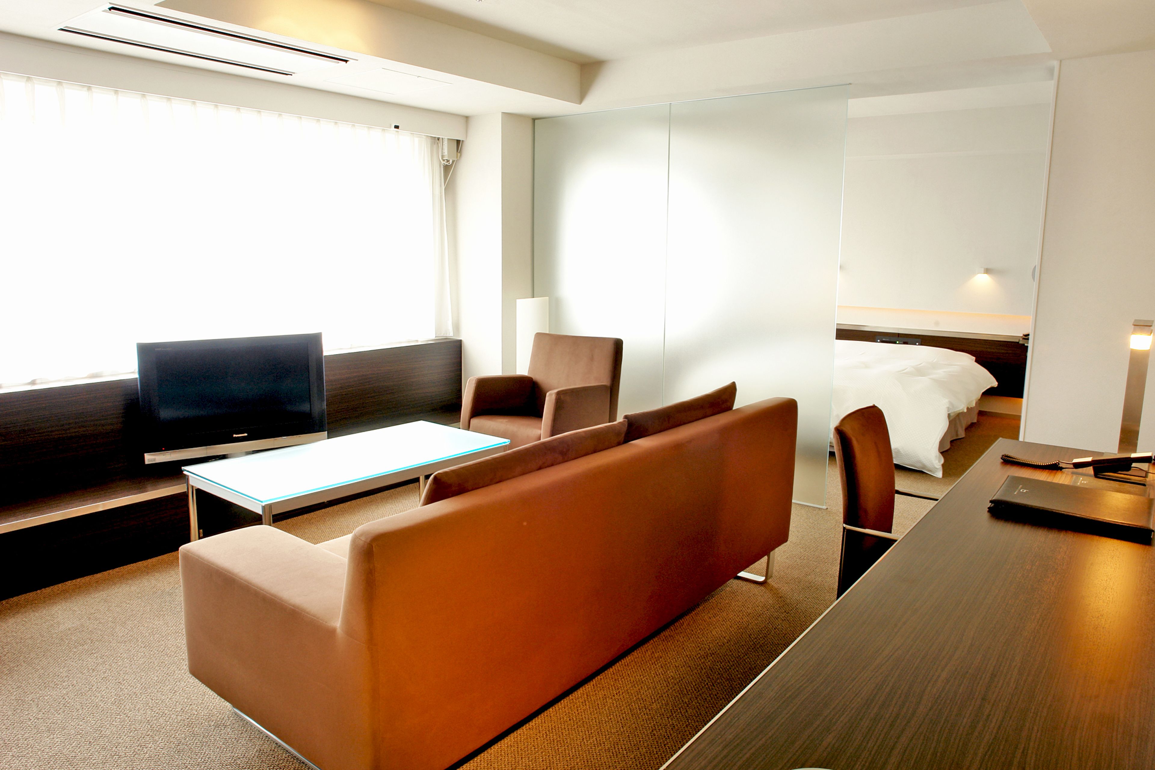 exclusive double room, non smoking | living room | flat-screen tv, pay films