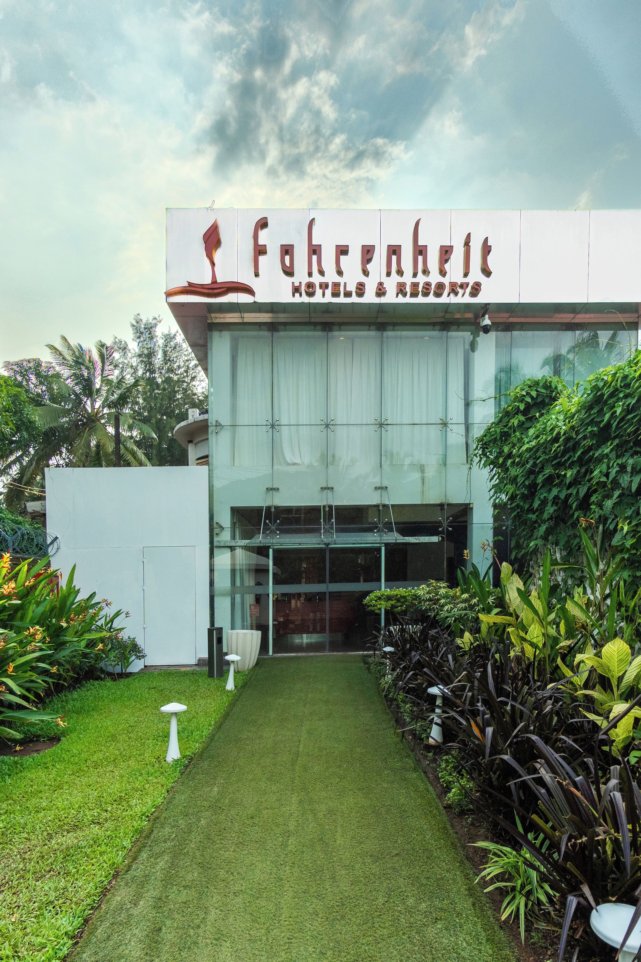 A building with a sign reading "Fahrenheit Hotels & Resorts".