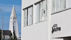 A modern hotel building with a sign reading "HOTEL KLETTUR". - Hotel Klettur (Reykjavik)