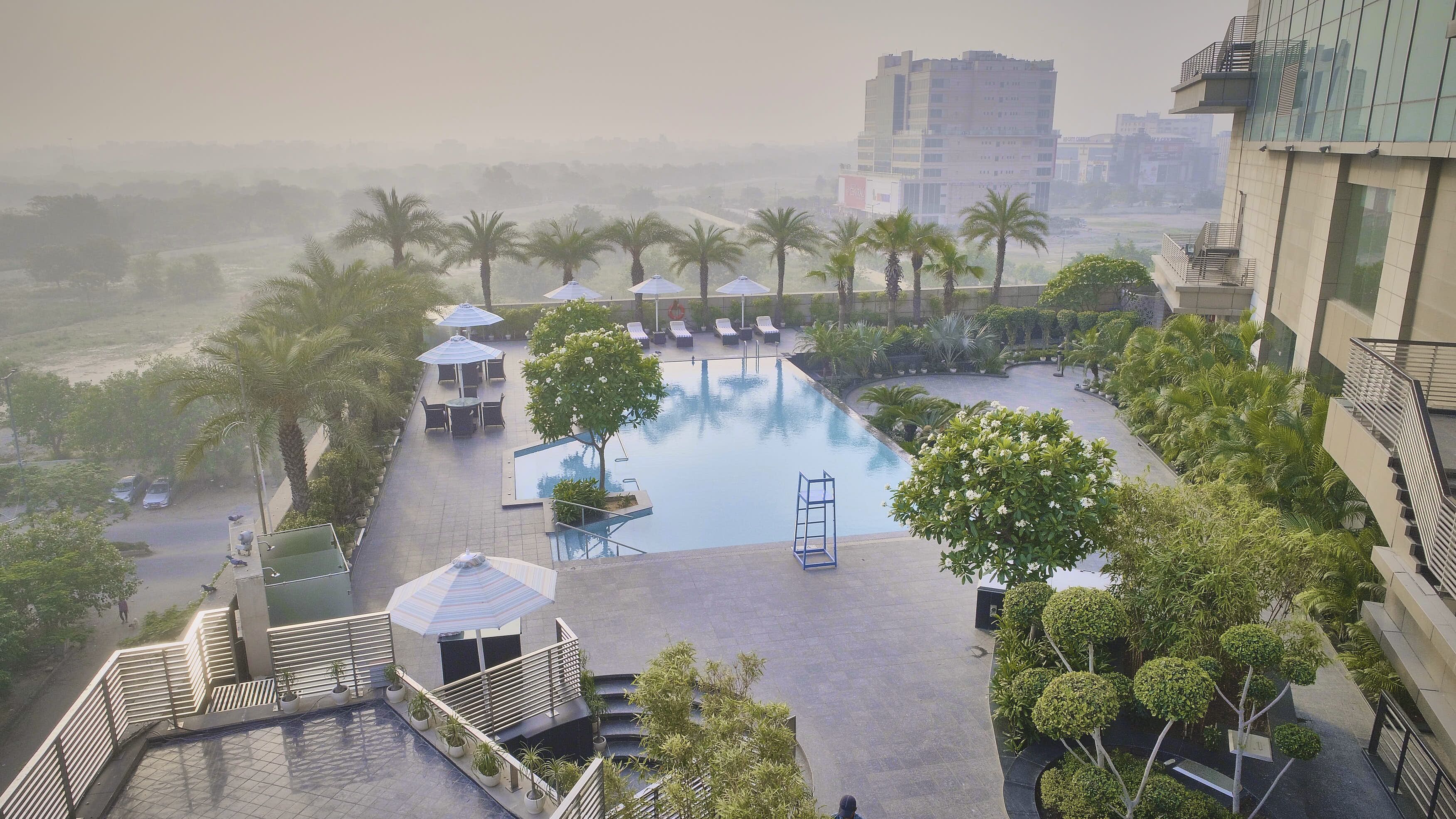 Outdoor pool, open 7:00 AM to 8:00 PM, pool umbrellas, sun loungers