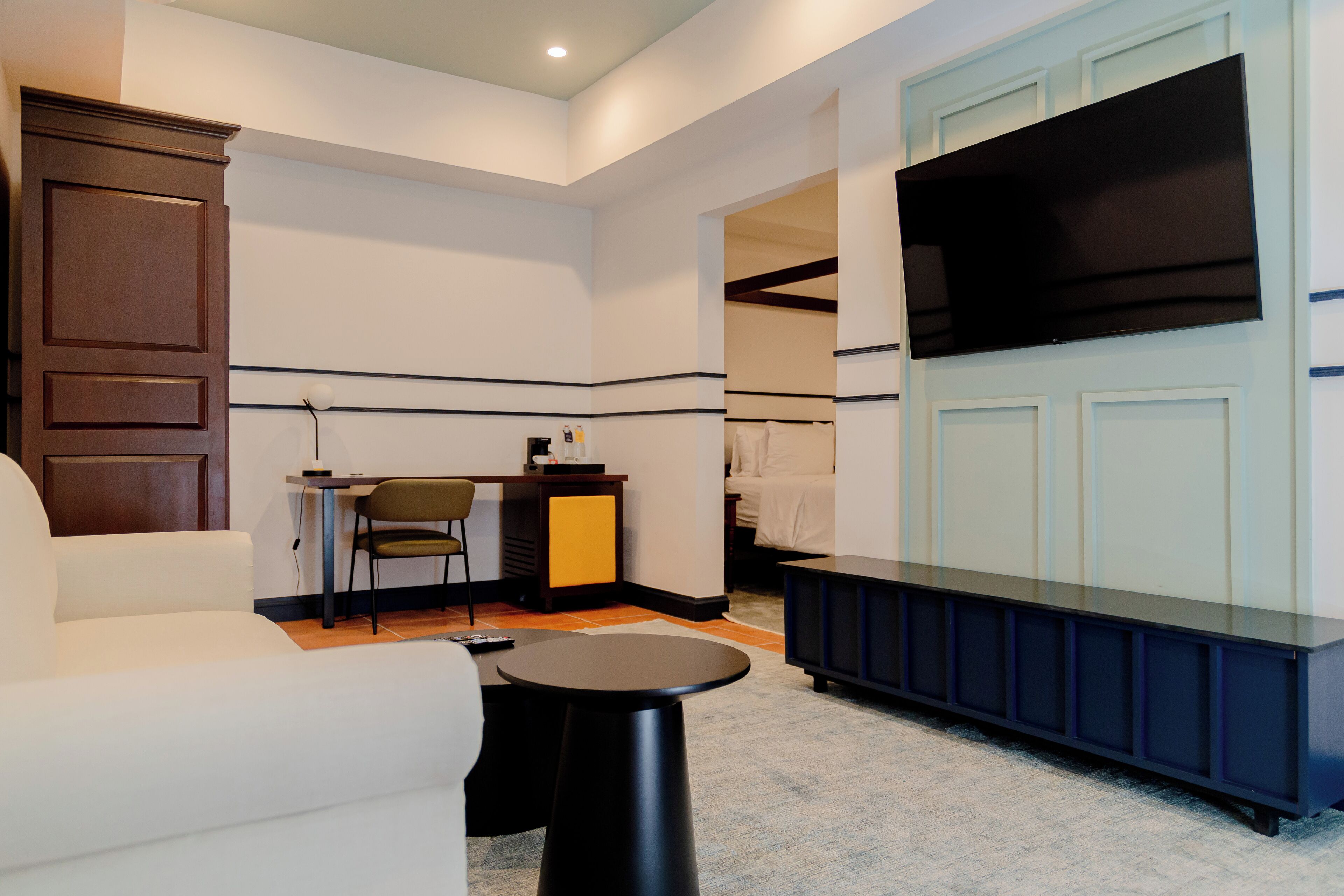 Suite, 1 Queen Bed | Living area | 32-inch plasma TV with cable channels, TV, first-run movies