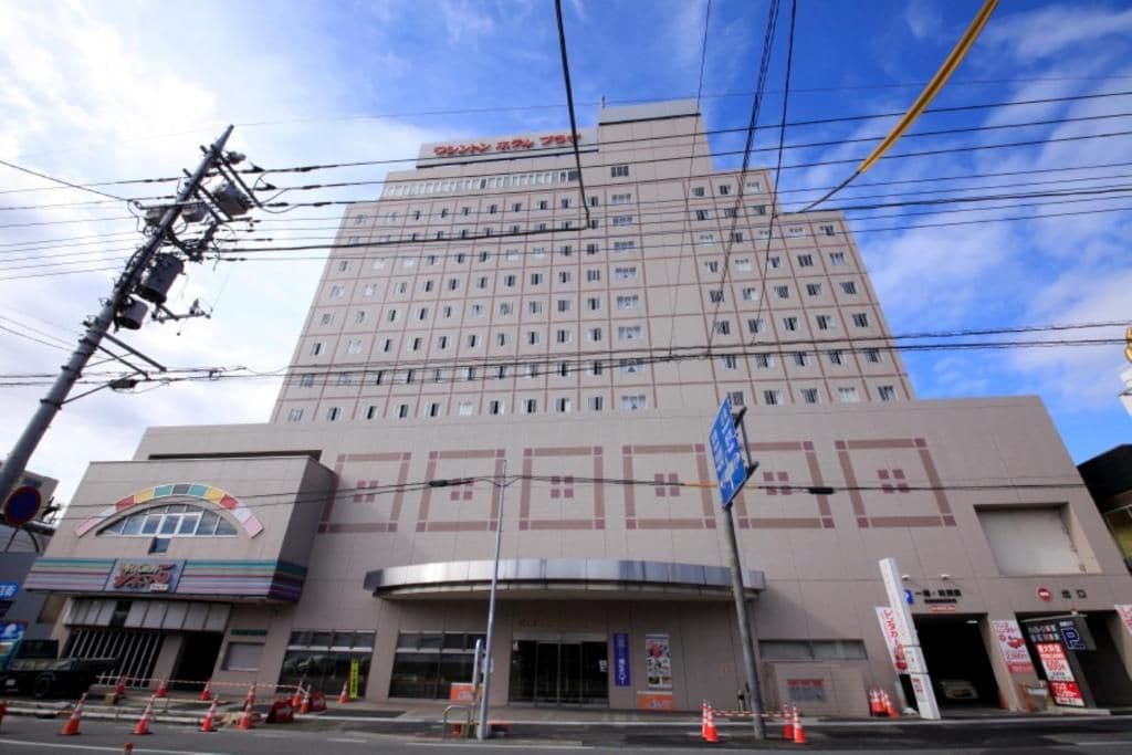 A multi-story hotel with a prominent entrance and signage.