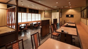 A traditional Japanese restaurant interior with tatami mat seating, wooden tables, and shoji screens. - Nara Washington Hotel Plaza (Nara)