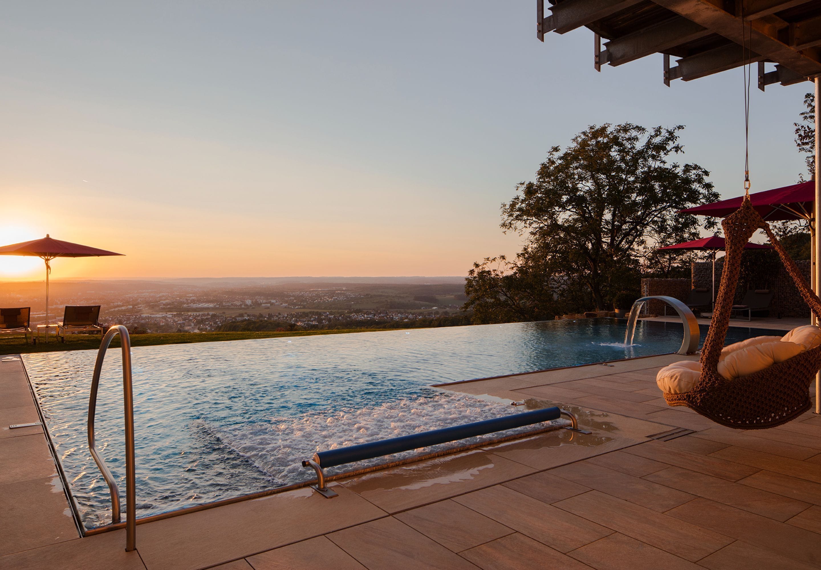 outdoor pool, open 7:00 am to 8:00 pm, pool umbrellas, pool loungers