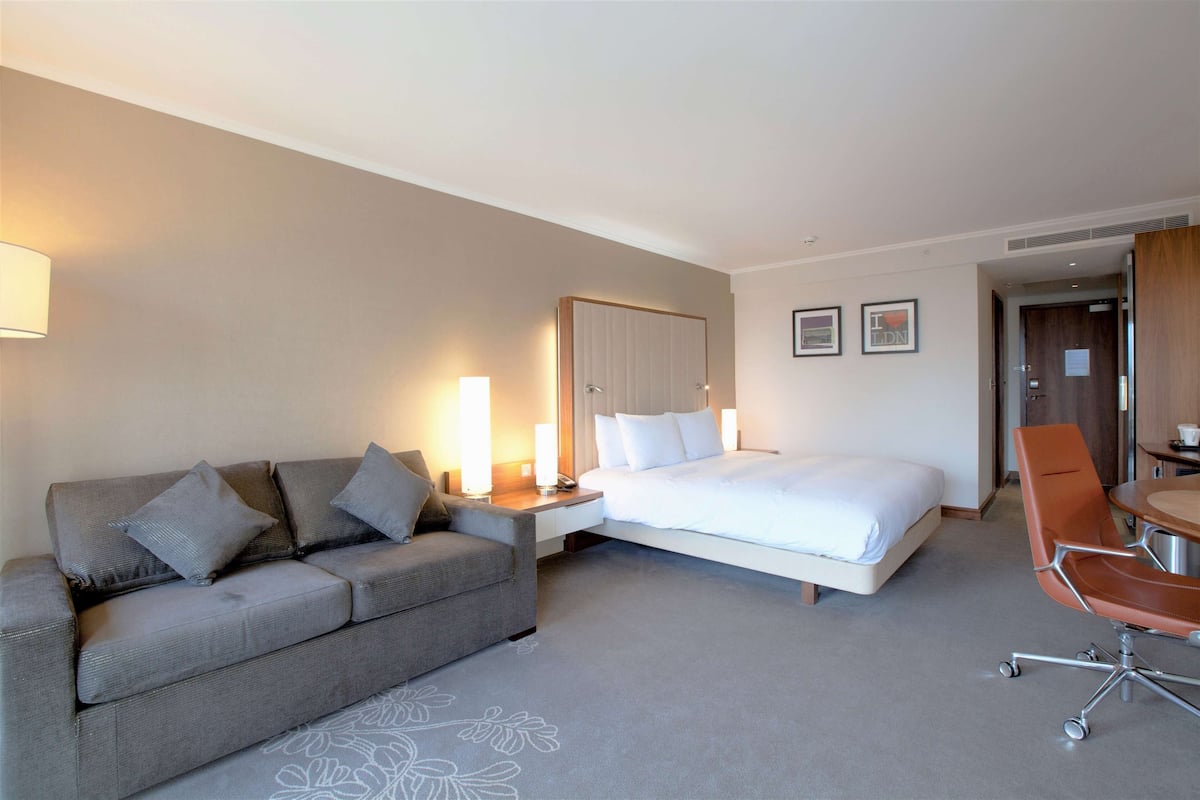 Family Room, 1 King Bed | Living area | 37-inch LCD TV with cable channels, TV