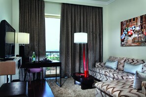Executive Suite, Pool View | Living room | 46-inch LCD TV with premium TV channels, TV - Mövenpick Ambassador Hotel Accra (Accra)