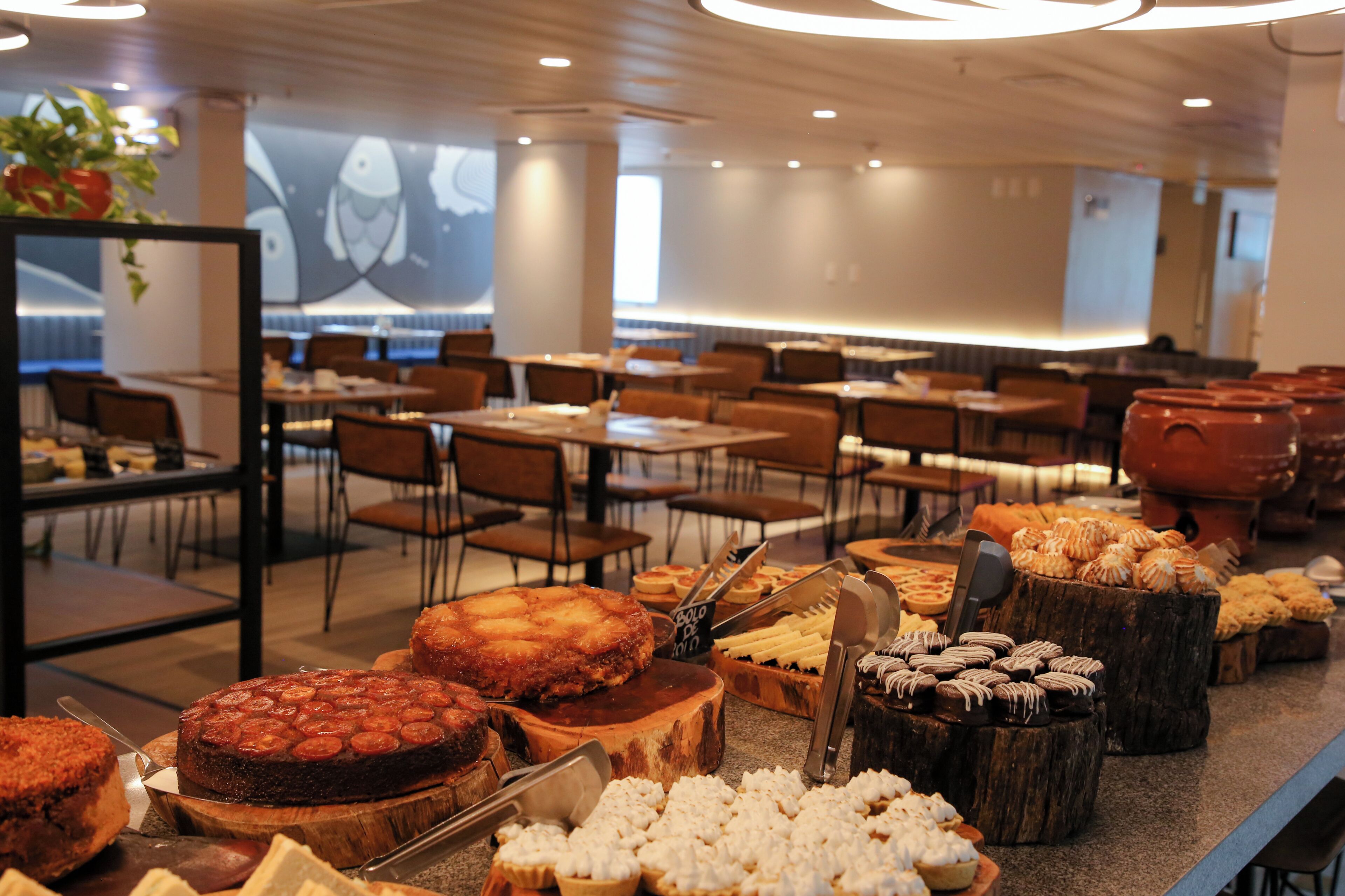A buffet with various desserts and pastries.