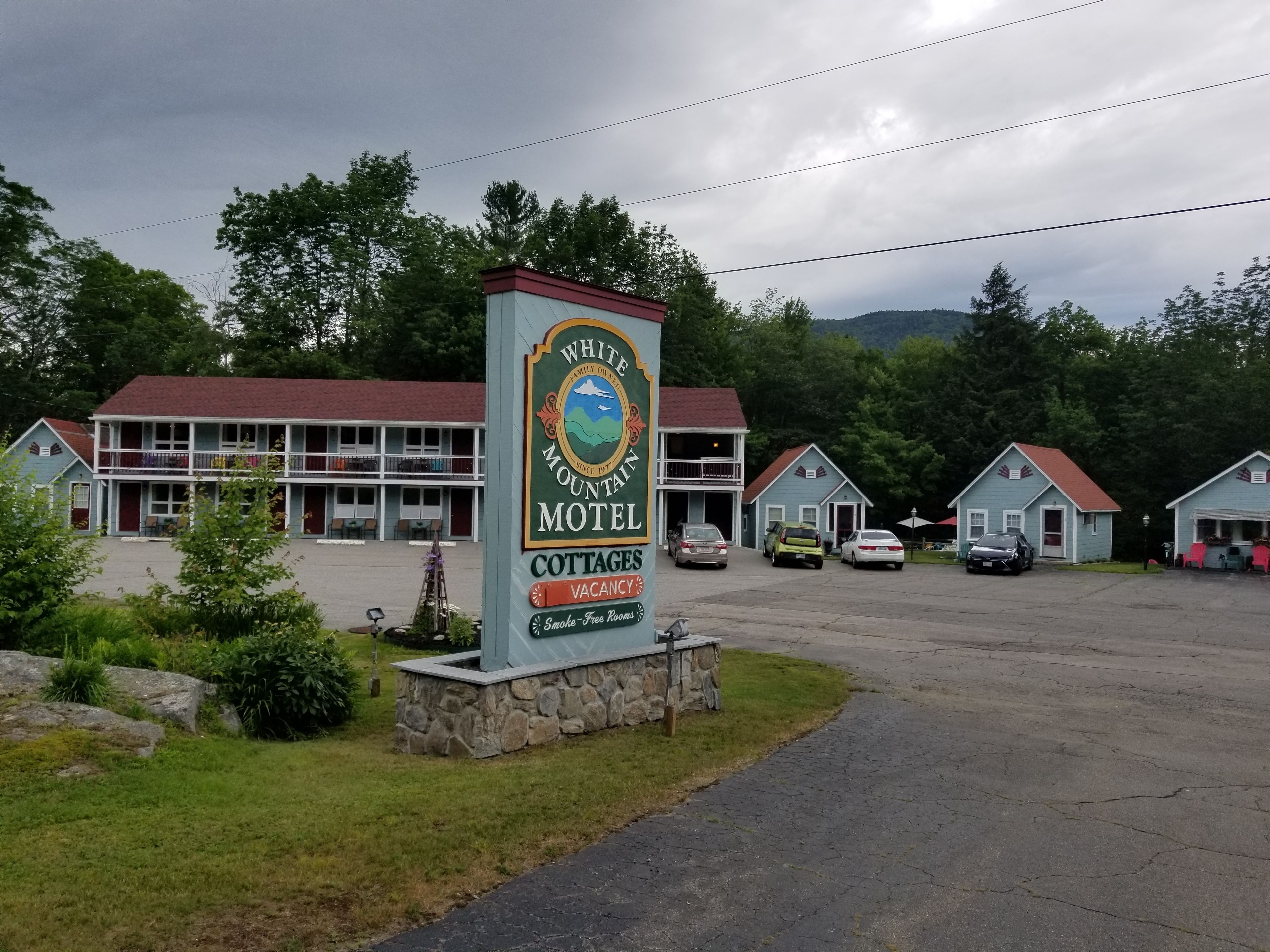 A motel sign with a mountain emblem, indicating a family-owned establishment since 1977.