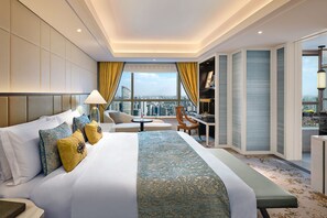 A hotel room with a large bed, a desk, a chair, and a view of the city. - The St. Regis Shanghai Jingan (Shanghai)