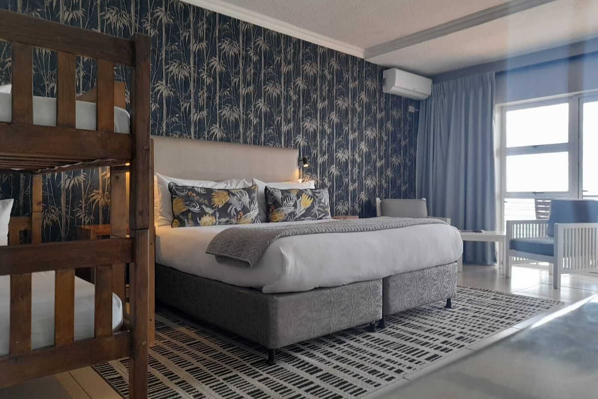 standard quadruple room | in-room safe, desk, blackout curtains, iron/ironing board